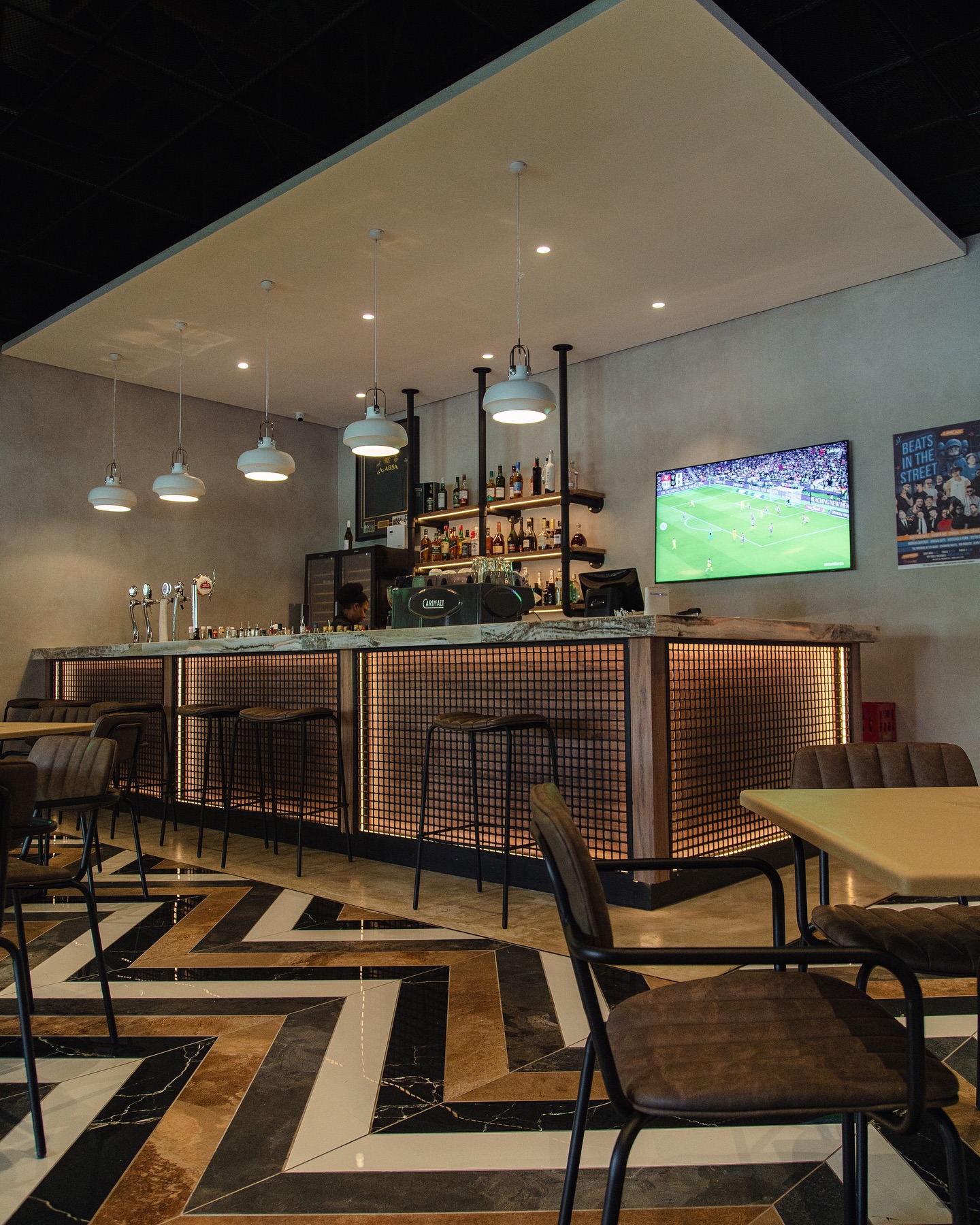 Inside Nineteen45 — the bar and the screens